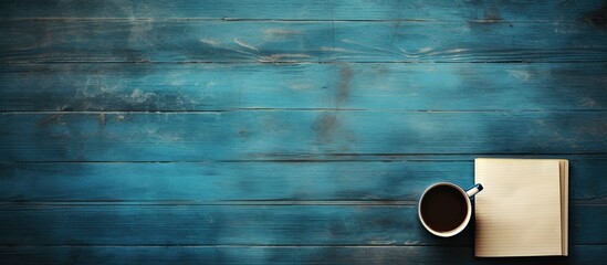 Aufkleber - Open empty notebook on blue wooden table retro background. copy space available
