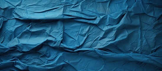 Poster - blue crumpled paper texture background. copy space available