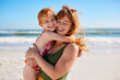 © Rido - Mother and daughter with red hair having fun at beach while hugging