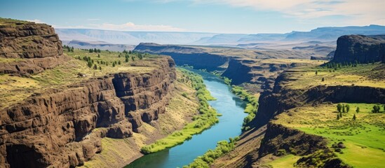 Wall Mural - Scenic cliff top view overlooking a canyon river with islands providing ample copy space image