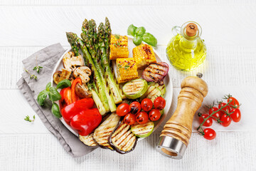 Wall Mural - Assorted grilled vegetables on a plate, showcasing a colorful and healthy meal