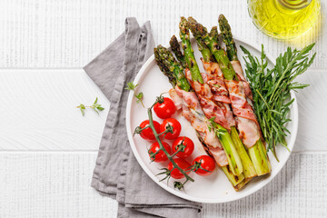 Wall Mural - Grilled asparagus with bacon and egg sauce on a plate