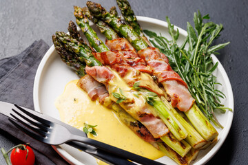 Wall Mural - Grilled asparagus with bacon and egg sauce