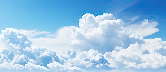 Canvas Print - Background featuring a blue sky with clouds providing copy space image