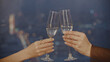 © Media Whale Stock - Close-up of two female hands clinking glasses of champagne. Media. Beautiful female hands clink champagne. Women clink glasses of champagne in expensive restaurant
