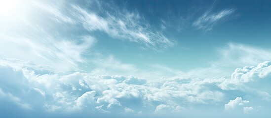 Wall Mural - blurred gradient representing serene nature with a beautiful blue sky and clouds drifting in the win