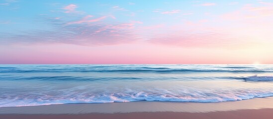 Wall Mural - Scenic beach view at dusk with a beautiful sunset and clear blue sky in the background perfect for a copy space image