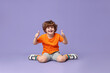 © New Africa - Happy little boy dancing on violet background. Space for text