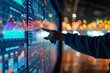 © Ilia Nesolenyi - An individual pointing at a screen showing vibrant business data and analytics in real-time