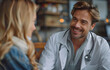 © Natalia - Doctor smiling while talking to patient.