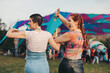 © Jacob Lund - Female friends screaming in celebration at a vibrant music festival