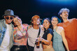 © Jacob Lund - Fun nightlife with friends: Young people enjoying themselves at a musical concert