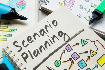 Notepad with scenario planning and schemes.