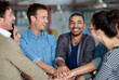 © peopleimages.com - Business people, meeting and hands together with team for collaboration, unity or synergy at office. Happy group, employees or young colleagues piling for motivation, agreement or union at workplace