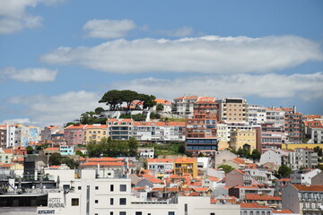 Canvas Print - Aerial view of buildings and landmarks in Lisbon Portugal with incredible architecture and a blue sky background. 