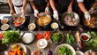 © Plaifah - A traditional Thai cooking class with participants preparing dishes at individual stations, with fresh ingredients laid out.