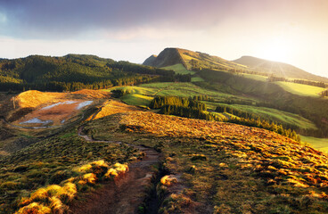 Wall Mural - amazing mountain landscape with colorful vivid sunset on the cloudy sky, natural outdoor travel back