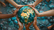 © Sami - Saving the planet concept with multiple hands holding Planet Earth Globe above their head