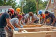 © SaroStock - a group of men working on a wooden structure, A diverse group of volunteers cleaning up a community park
