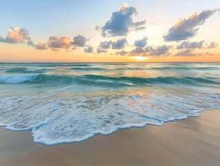 Sticker - A serene beach scene at dawn with soft waves gently lapping the shore and a colorful sunrise in the background