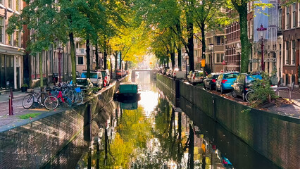 Wall Mural - Amsterdam autumn cityscape narrow old houses, canals, boats Amsterdam, Netherlands September 20, 2023