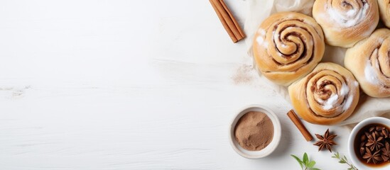 Wall Mural - a homemade recipe for sweet and traditional cinnamon rolls with raw dough preparation the food ingre