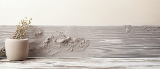 Wall Mural - an image of gray cosmetic clay rests on an aging white wooden table leaving ample copy space for add
