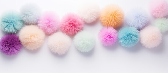 Aufkleber - Fluffy pastel pom poms in various sizes randomly arranged on a white background make for an appealing copy space image