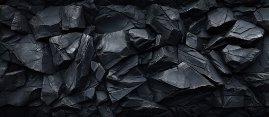 Wall Mural - a background image featuring a texture of black stone with empty space for copy purpose