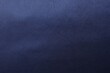 © New Africa - Texture of dark blue silk fabric as background, top view