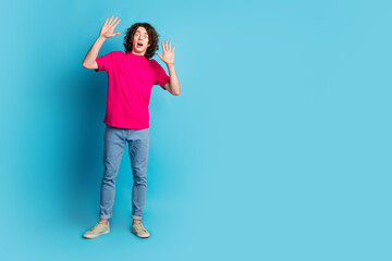 Sticker - Full length portrait of nice young man raise arms empty space wear t-shirt isolated on blue color background