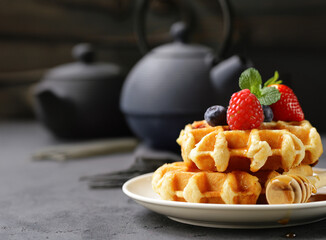 sweet waffles with berries for breakfast