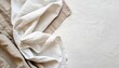 © Juliane - White crumpled linen fabric texture background. Natural linen organic eco textiles canvas background. Two shades of white color linen cloth material. Top view, copy space