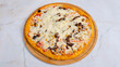 © Tural - Delicious Italian pizza isolated top view