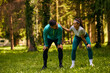 © Drazen - Happy athletic couple taking  break after running in nature. Copy space.