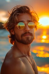 Wall Mural - handsome masculine man wearing sunglasses relaxing 
go for a walk on beach at sunset time