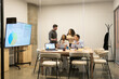 © ADDICTIVE STOCK - Diverse Team Collaborating in Modern Coworking Space