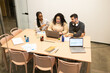 © ADDICTIVE STOCK - Diverse team collaborating in a modern coworking space