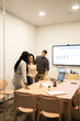 © ADDICTIVE STOCK - Diverse team discussing sales evolution in a modern coworking space