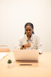 © ADDICTIVE STOCK - Young professional working at a minimalist coworking space
