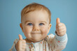 © Frédéric Prochasson - Cute smiling happy baby boy showing thumbs up, AI generated