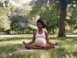 © seelya - Pregnant Woman Meditating in a Sunny Park