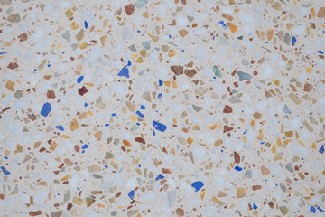 Aufkleber - A mosaic tile floor with a variety of colors and textures. The tiles are scattered all over the floor, creating a unique and interesting pattern. Scene is one of creativity and artistic expression