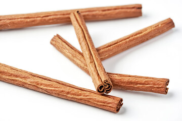 Poster - Cinnamon Sticks on White Background