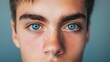 © Mikus - A close-up of a person with multiple freckles scattered across their face and blue eyes