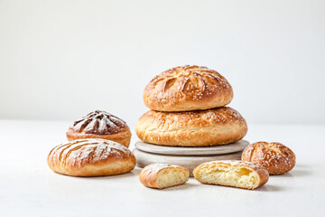 Wall Mural - Freshly Baked Bread Rolls on a White Surface