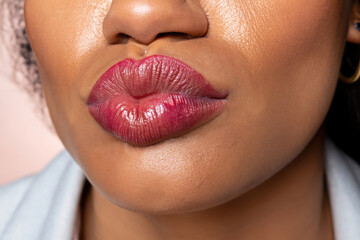 lips of a woman giving a kiss, perfect lips, glamour makeup, closeup on lipstick