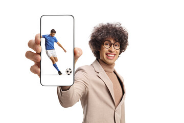 Sticker - Happy young man showing a smartphone with football player on the screen