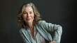 © furyon - radiant confidence smiling woman in her 50s exudes poise in classic blazer studio portrait photography