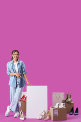 Sticker - Young Asian seller with blank poster and shoes on purple background